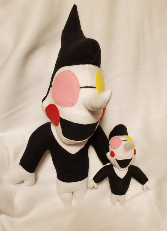 A photograph of a plush made by DayLikesCookies. The design is based on an indie-game puppet character.